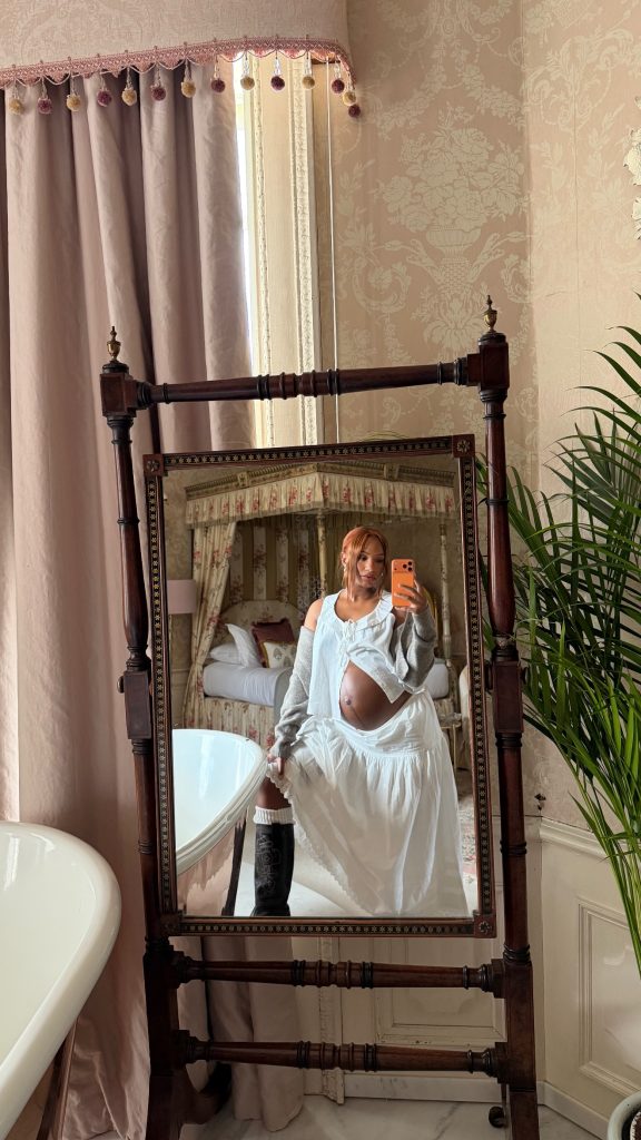 This image may contain Temi Otedola Skin Human Person Tattoo Plant Grass Clothing and Interior Design
