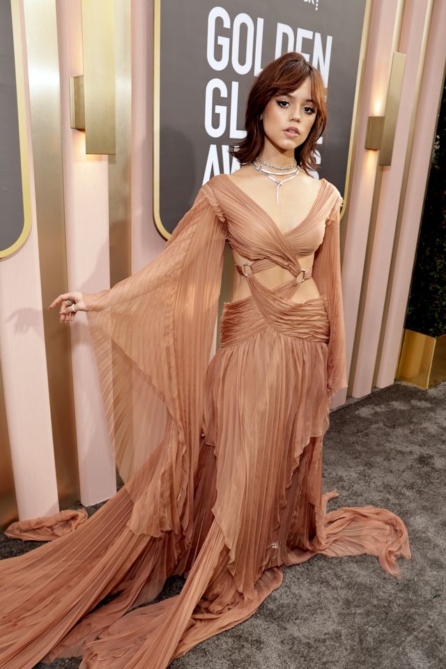 At the 2023 Golden Globes, Jenna Ortega Looks Stunning in an Evening Gown with Cutouts