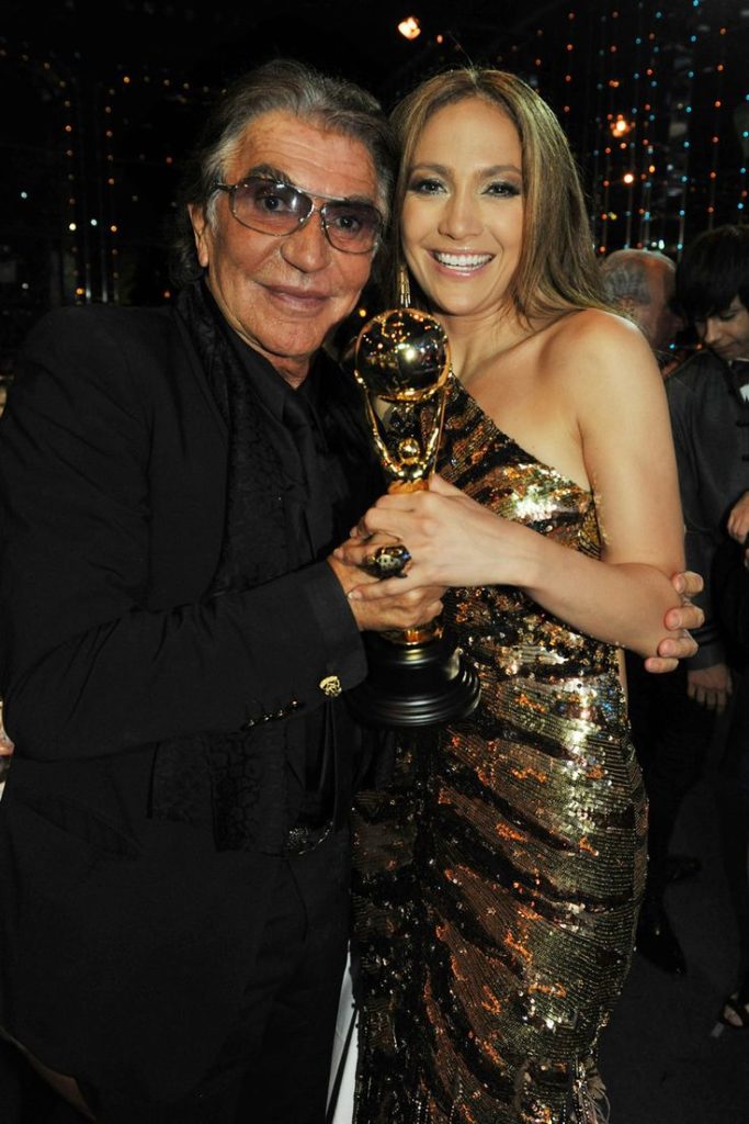 MONTE CARLO, May 18, 2010 - Roberto Cavalli with Jennifer Lopez who was wearing a spectacular vintage gown from the Roberto Cavalli FW 2004  2005 collection. It is completely embroidered with gold sequins and has a feather train.
