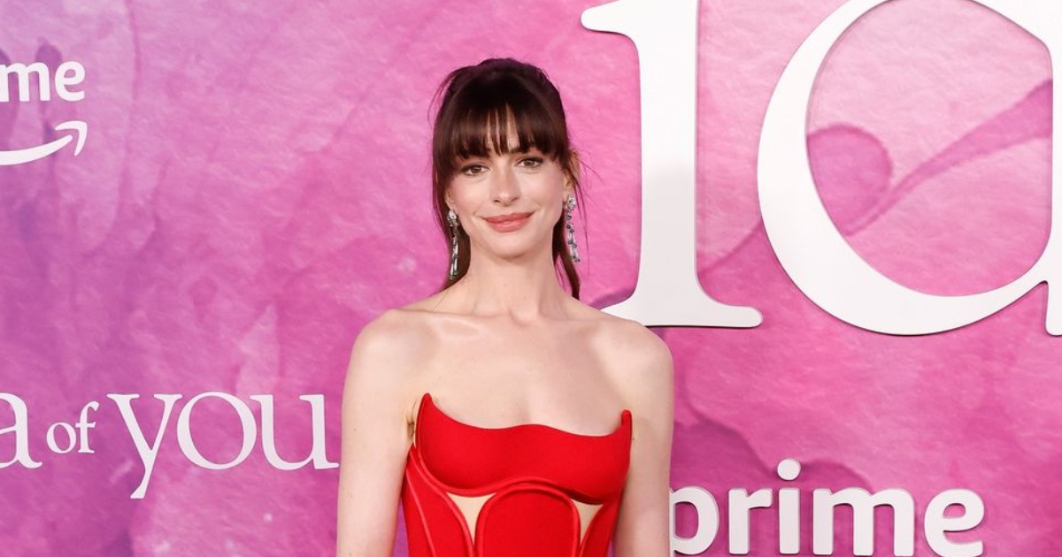 Anne Hathaway Radiates Elegance In Scarlet Versace Dress At New York ...