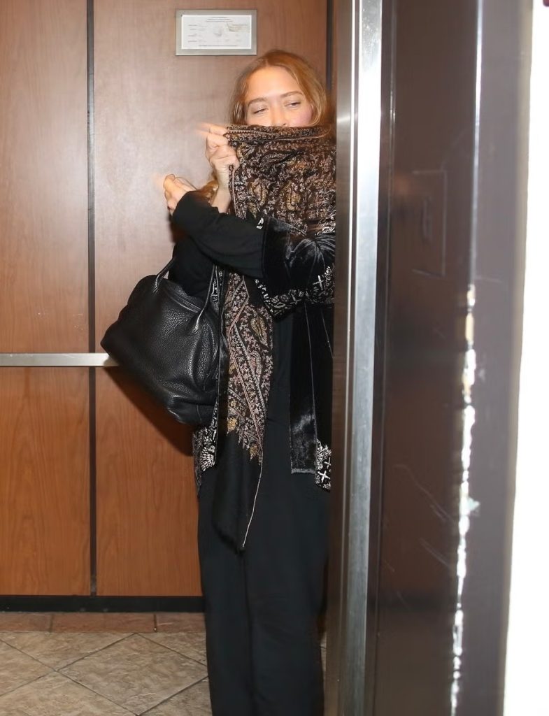 Mary-Kate Olsen Masters the Art of Discreet Drama in a Sculptural Scarf and Velvet Layers