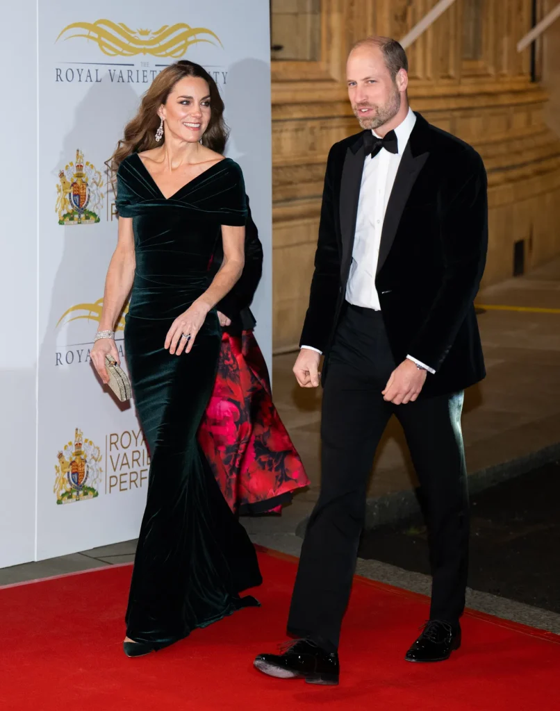 Image may contain Prince William Duke of Cambridge Fashion Adult Person Clothing Coat Premiere Face and Head The Princess of Wales arriving at the Royal Variety Performance with Prince William.