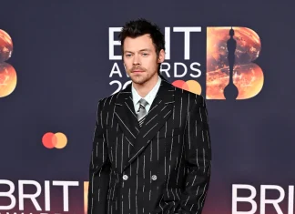 The Fashion 101 on Harry Styles’s Brit Awards Look Image may contain Harry Styles Clothing Formal Wear Suit Fashion Adult Person Coat and Pajamas