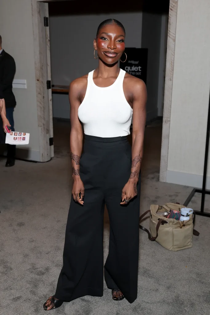 
Image may contain Michaela Coel Person Standing Accessories Bag Handbag Adult Dimples Face and Head
