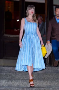 Image may contain Clothing Dress Black Hair Hair Person Formal Wear Head Adult Face Evening Dress and Photography