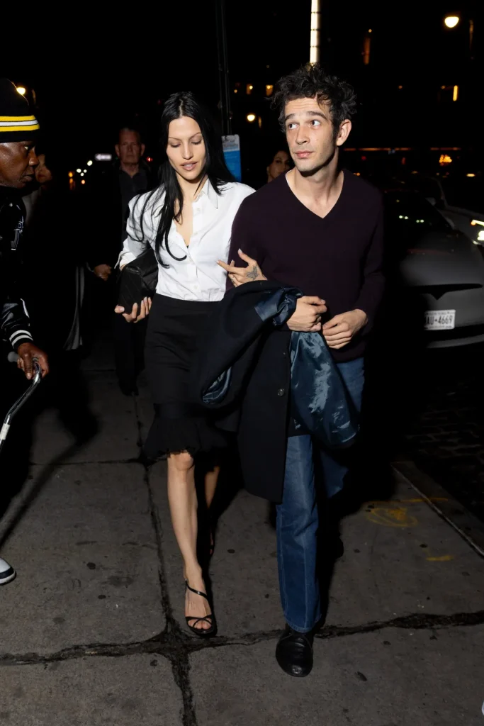 Image may contain Clothing Dress Black Hair Hair Person Formal Wear Head Adult Face Evening Dress and Photography