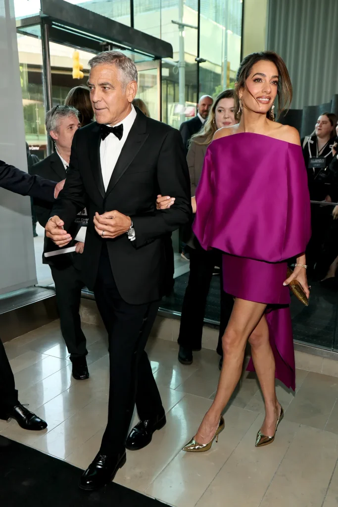 Image may contain Clothing Dress Black Hair Hair Person Formal Wear Head Adult Face Evening Dress and Photography
